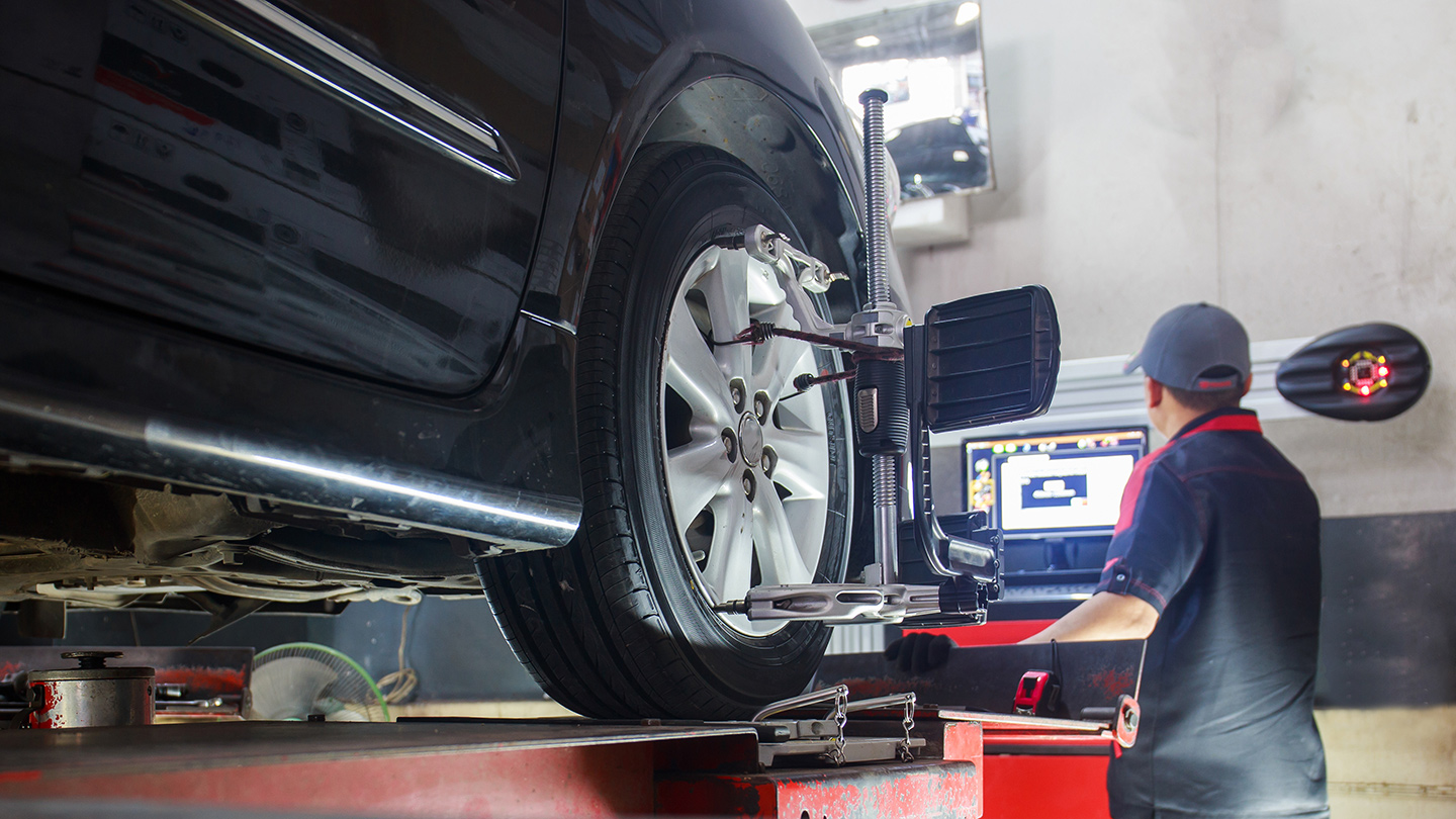 Modern Automotive technician tire balancing & tune-up